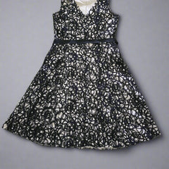 Black lace dress on a tiled floor