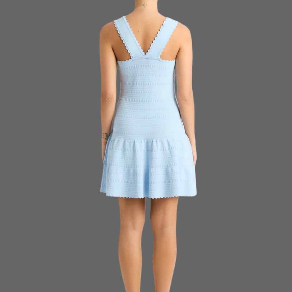 Light blue dress worn by a model on a white background