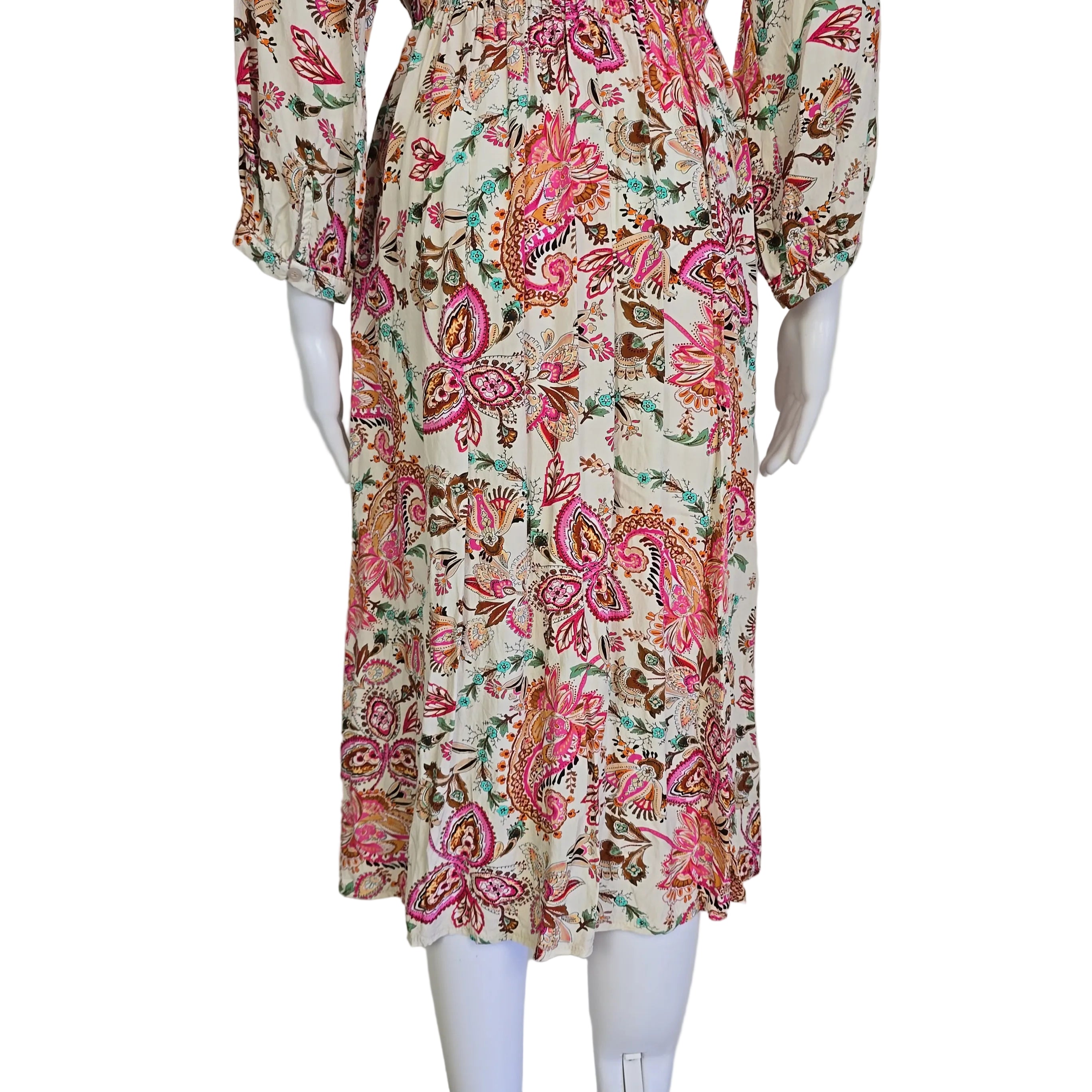 Floral dress on a mannequin against a white background