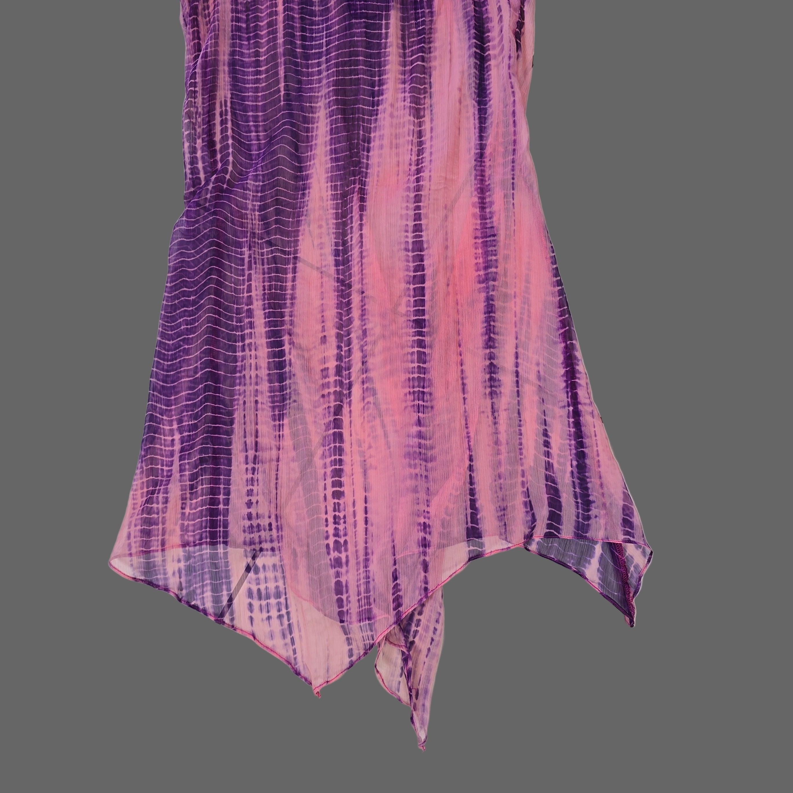 Purple and pink kaftan on a tiled floor