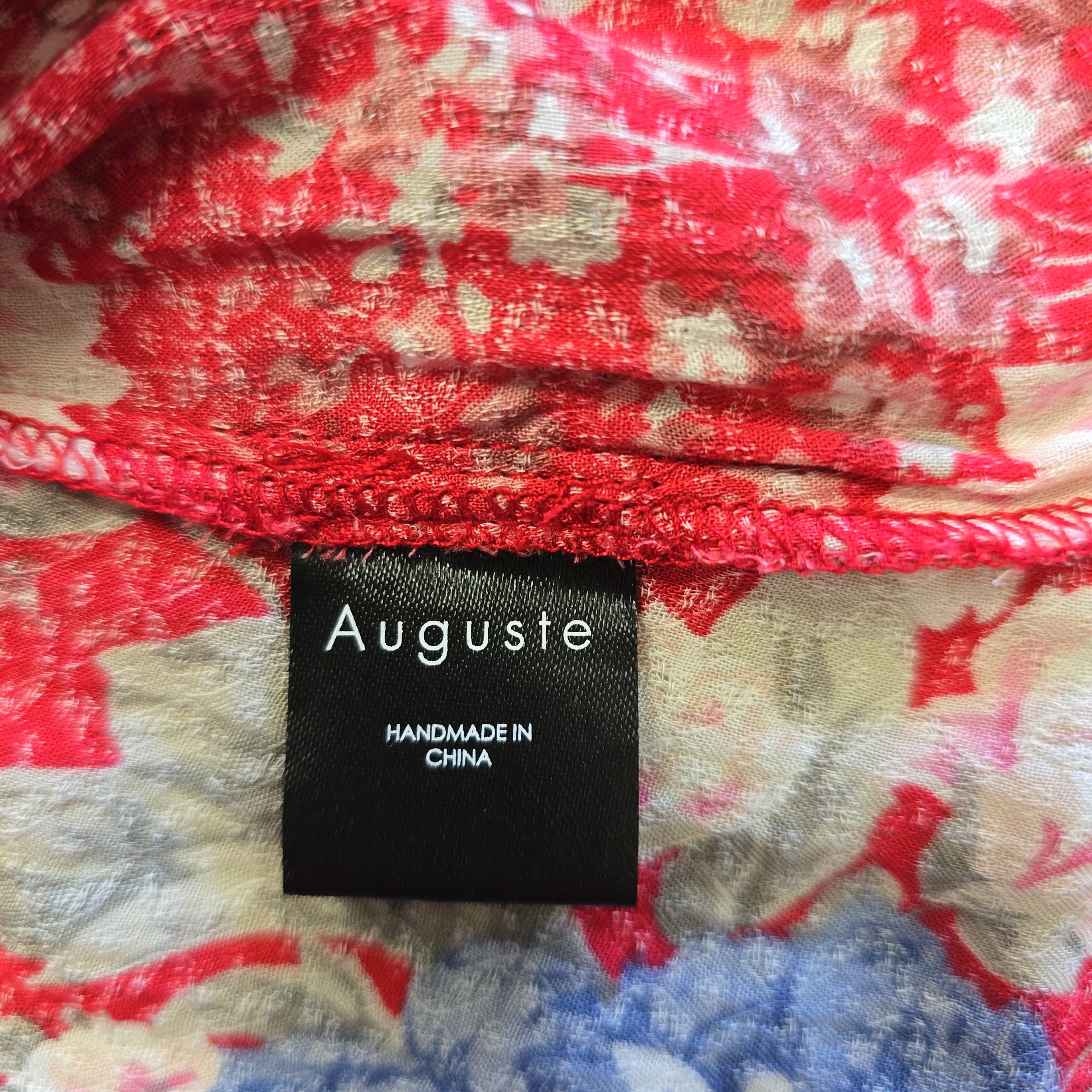 Floral fabric with a 'Auguste' label indicating handmade in China.