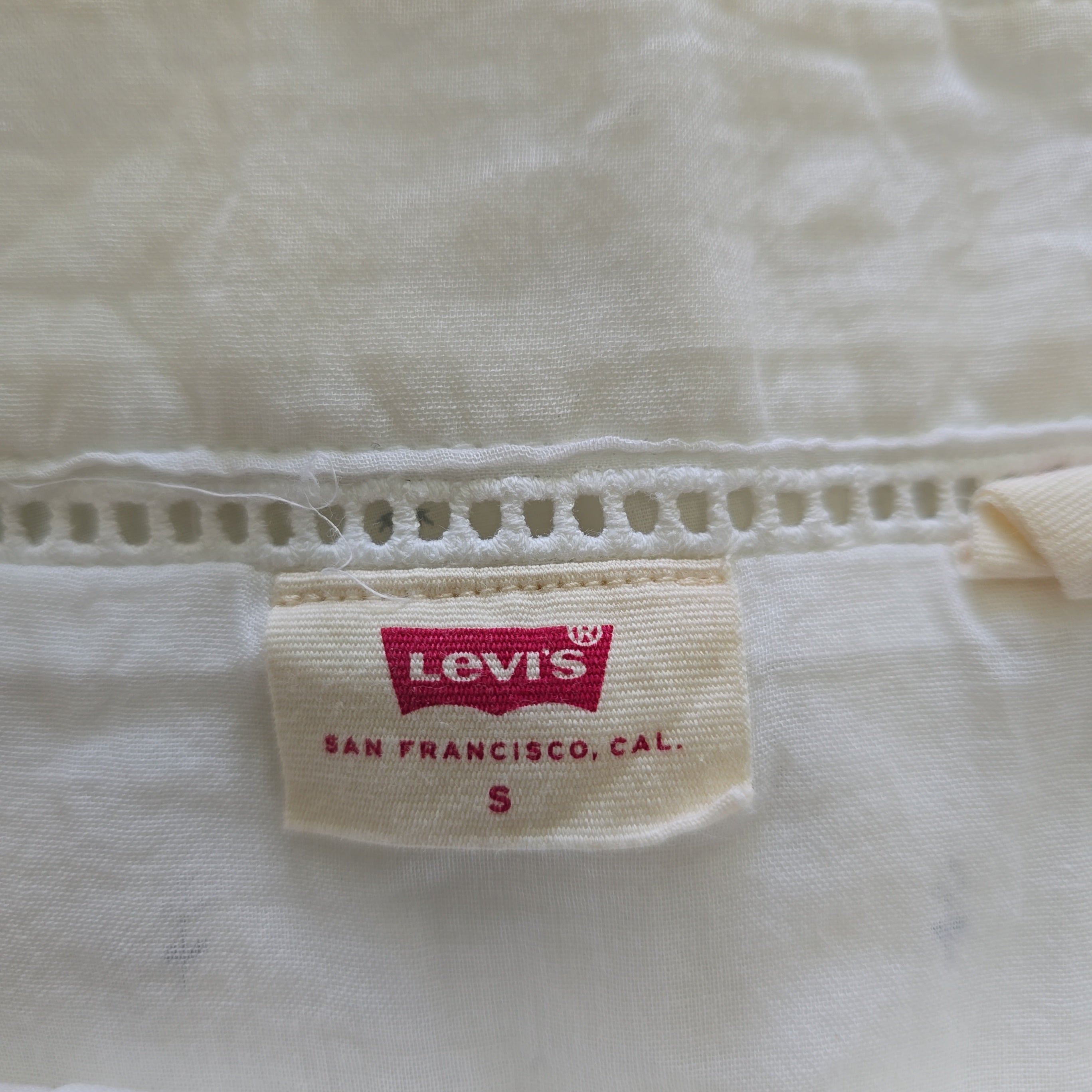 Levi's label on a white dress with visible stitching details
