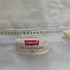 Levi's label on a white dress with visible stitching details