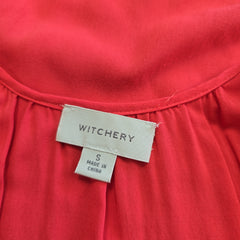 Witchery label on a red garment with 'Made in China' text