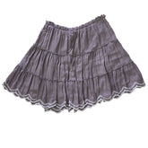 Grey ruffled skirt on a light background