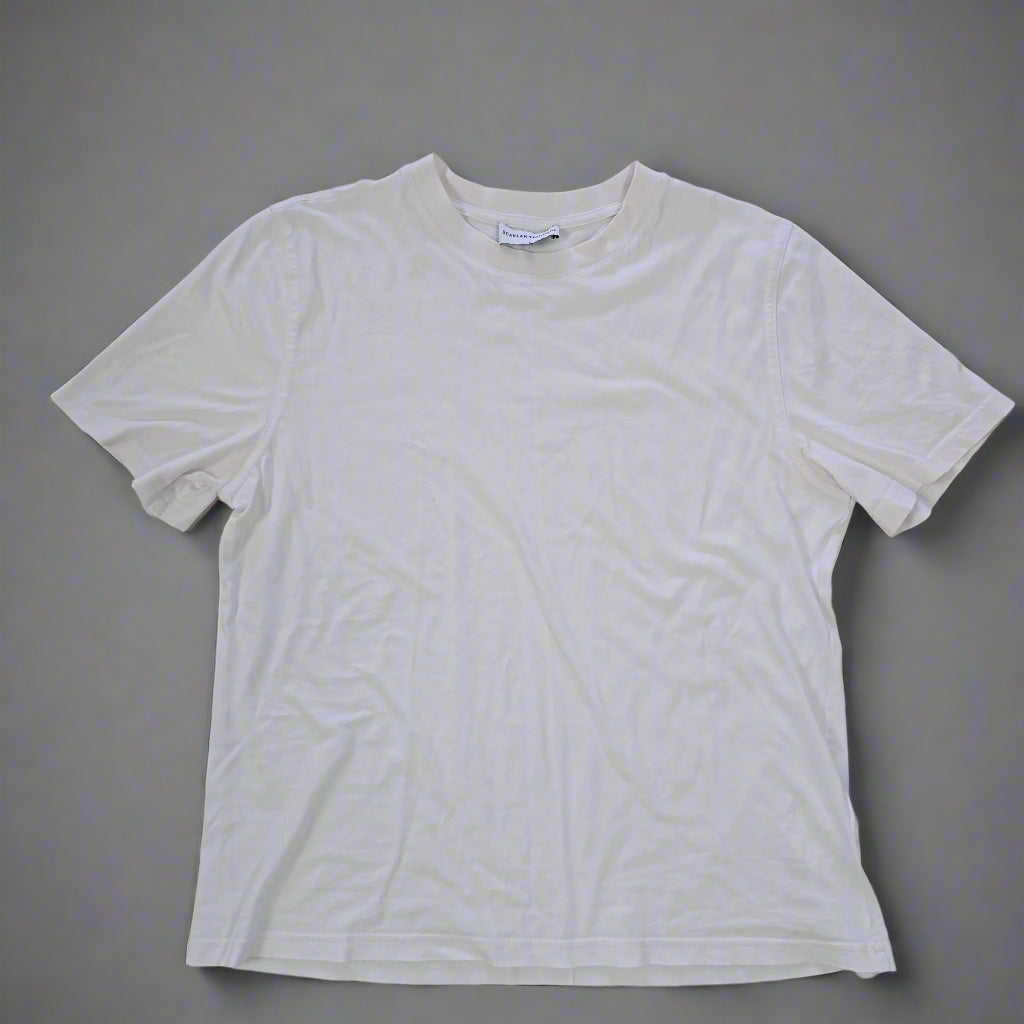 White t-shirt on a tiled floor