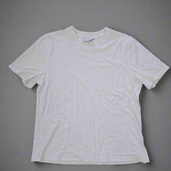 White t-shirt on a tiled floor