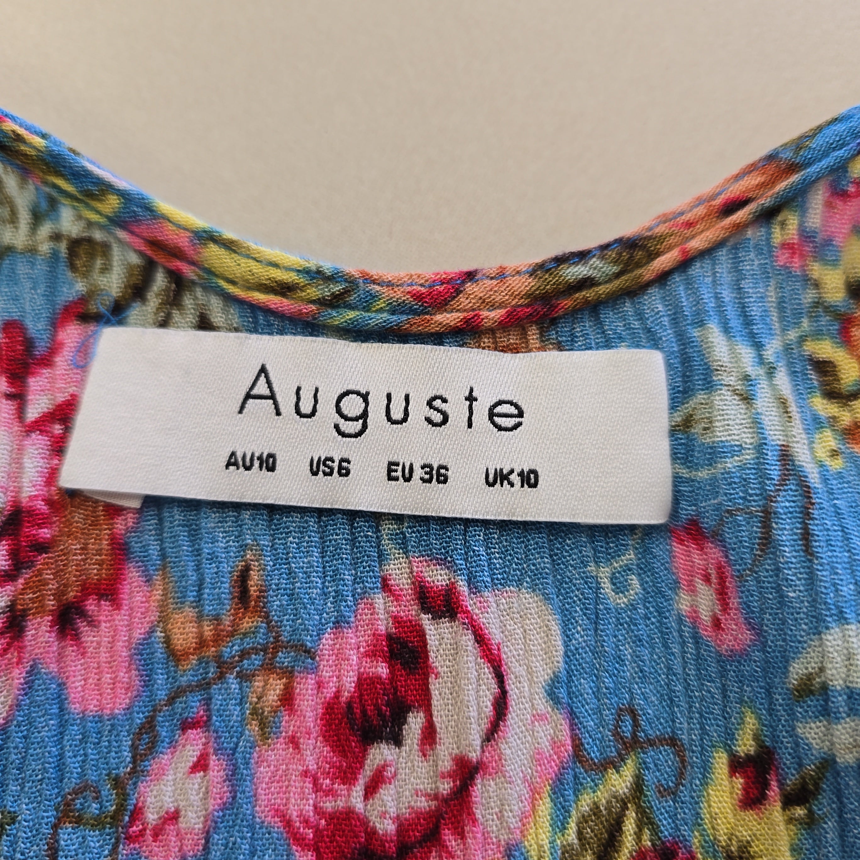 Floral fabric with an Auguste label showing size details