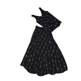 Black skirt and top set with gold patterns on a light background