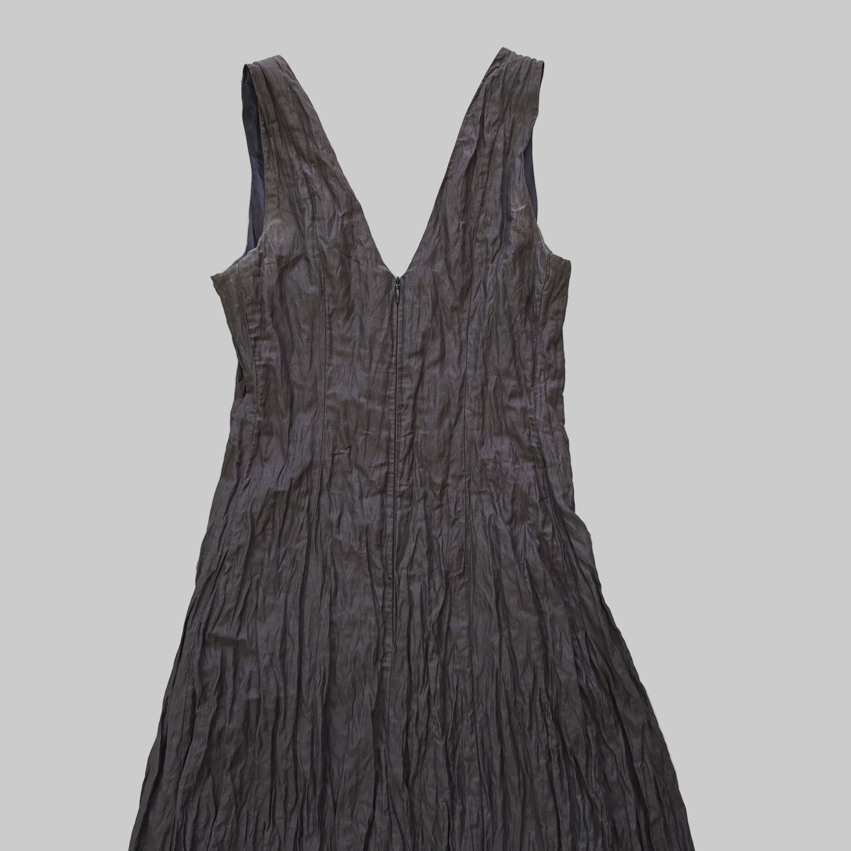 Dark gray dress on a tiled floor