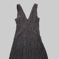 Dark gray dress on a tiled floor