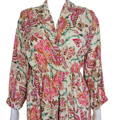 Floral patterned wrap style dress on a light background