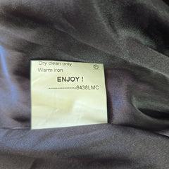 Label on a piece of fabric with text and numbers