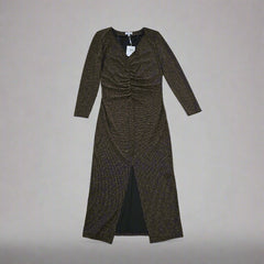 Black and gold textured dress against a light gray background