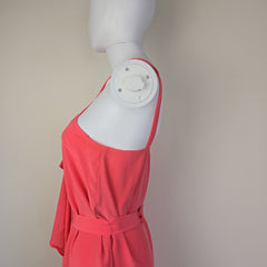 Red dress on a mannequin with a neutral background