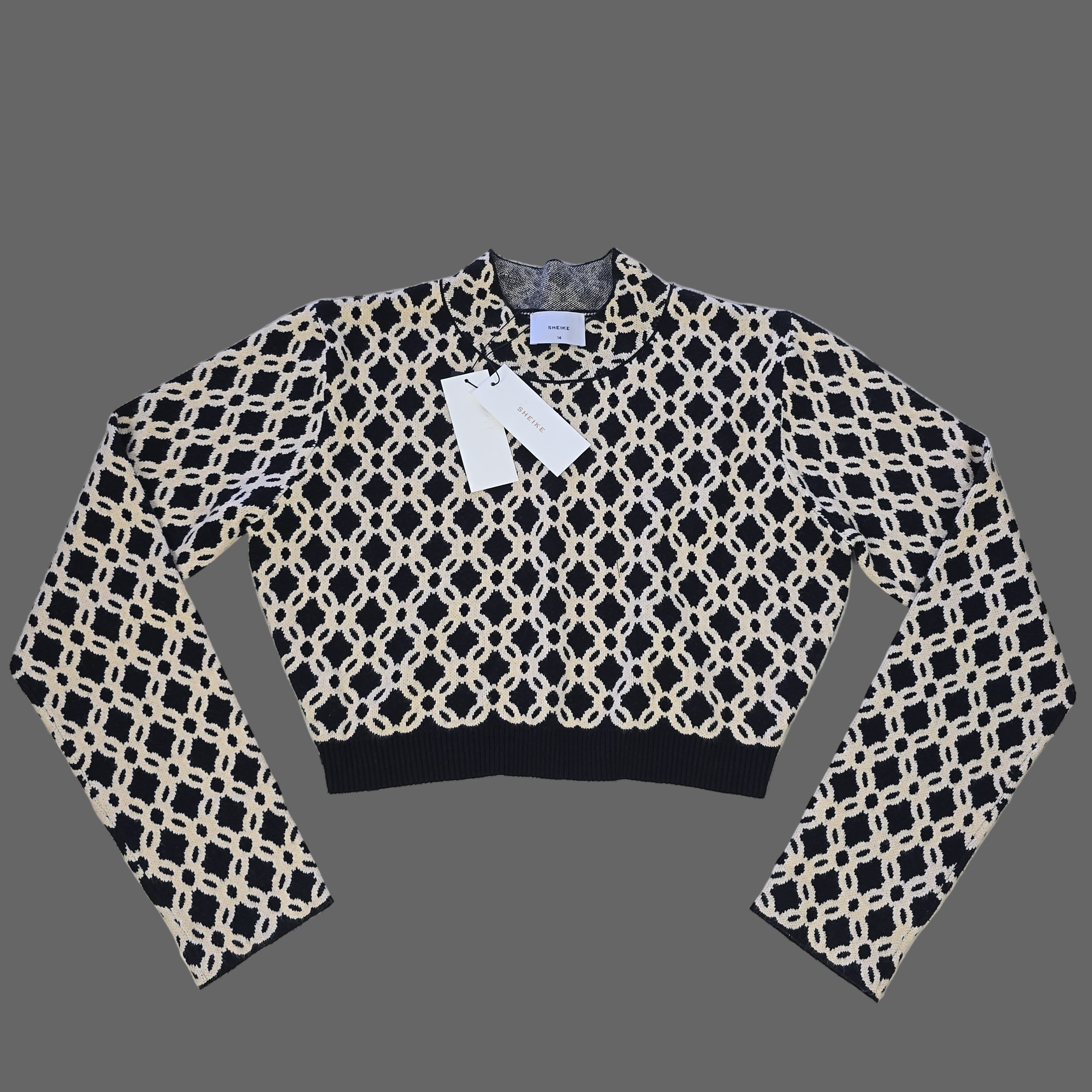 Black and white patterned top on a tiled floor