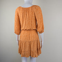 Orange floral dress on a light background