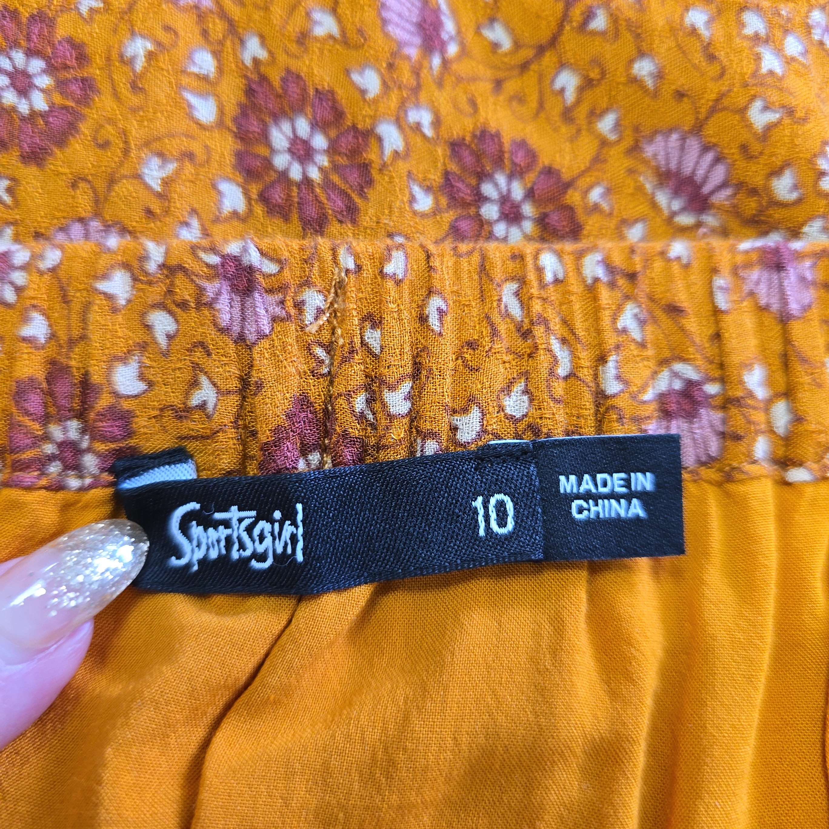 Clothing tag on a garment with floral pattern