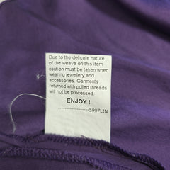Close-up of a purple garment with a label on it