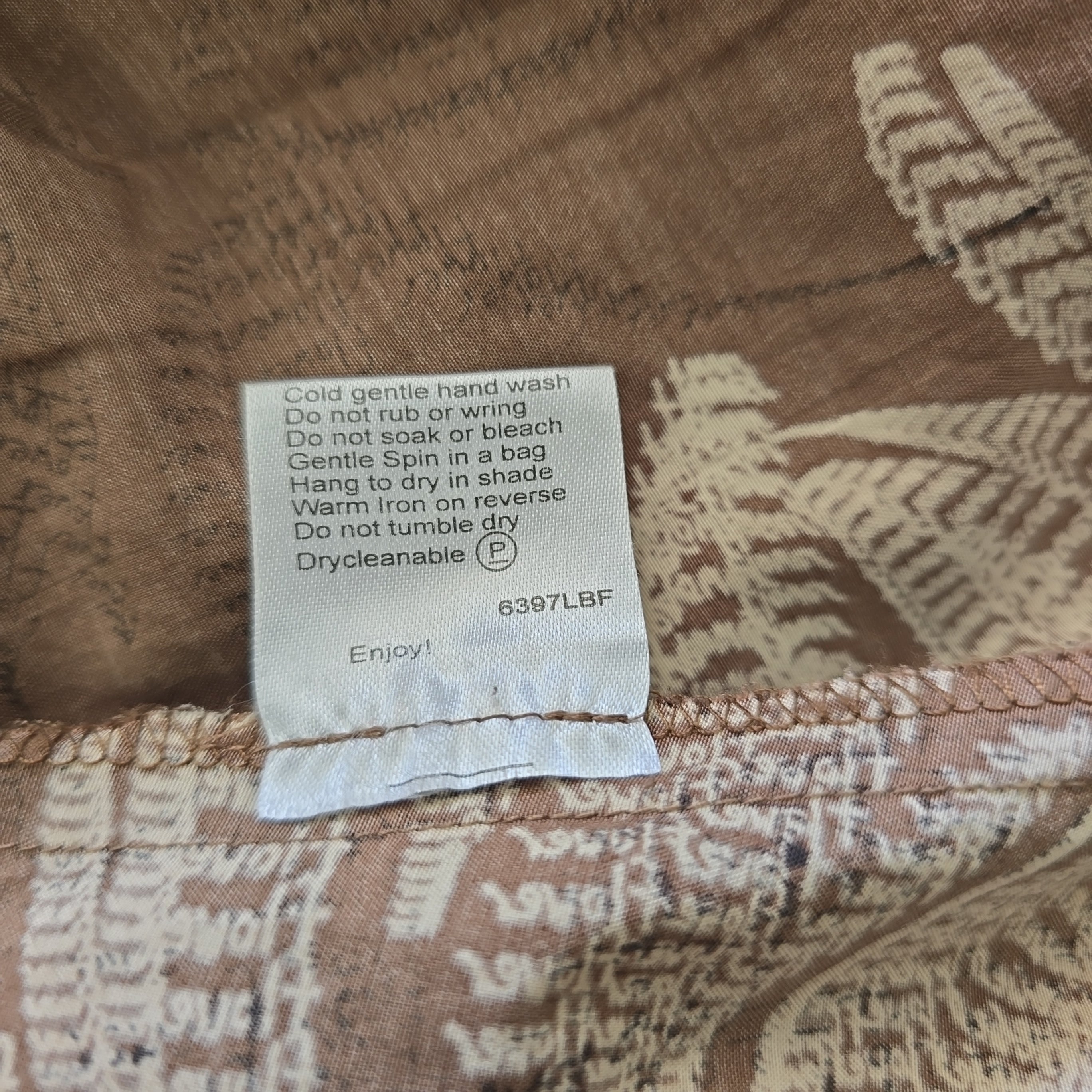 Fabric with a patterned label on a brown background