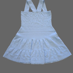 Light blue ribbed tank top with thin straps on a tiled floor.
