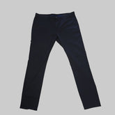 Pair of black pants on a tiled floor