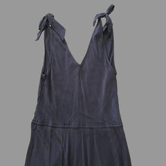 Dark grey dress on a tiled floor