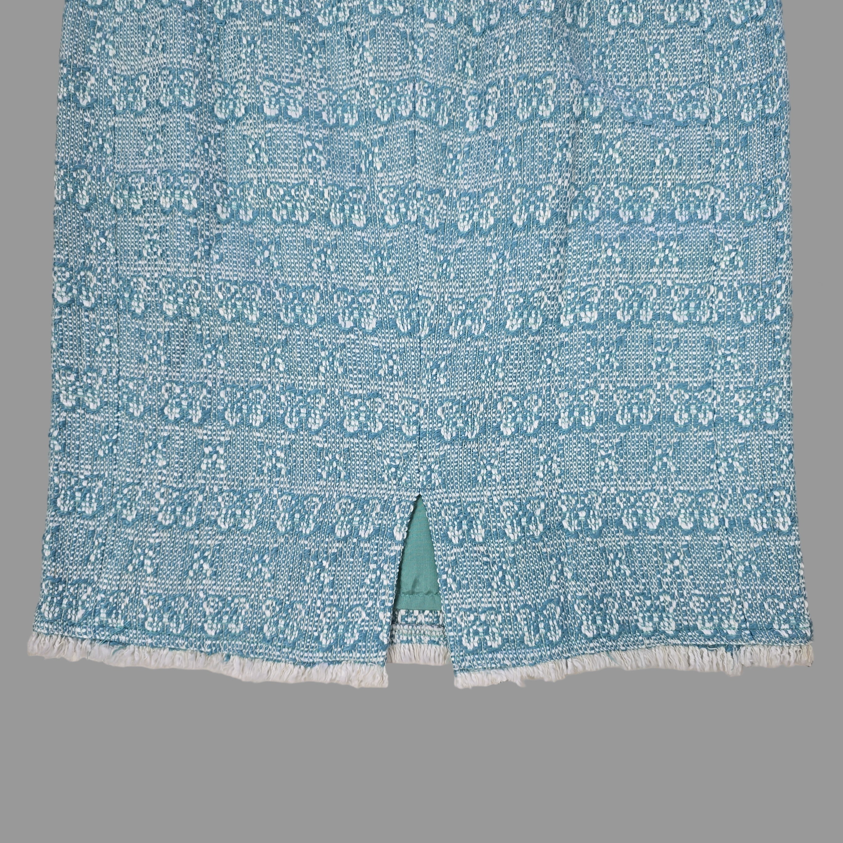 Blue textured fabric on a tiled floor