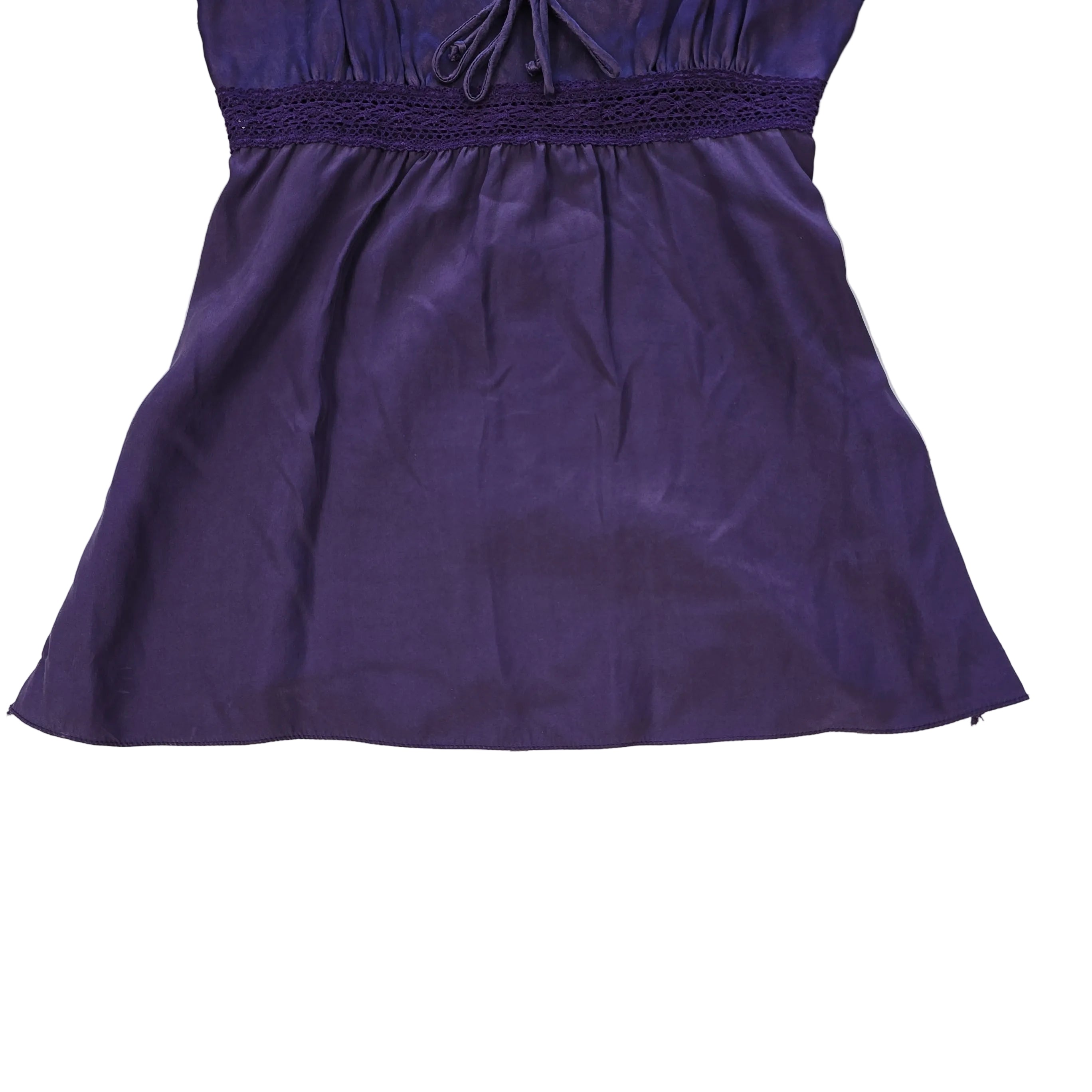 Purple lace-trimmed top on a light background