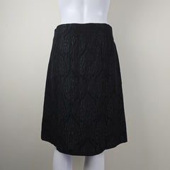 Black textured skirt on a white background