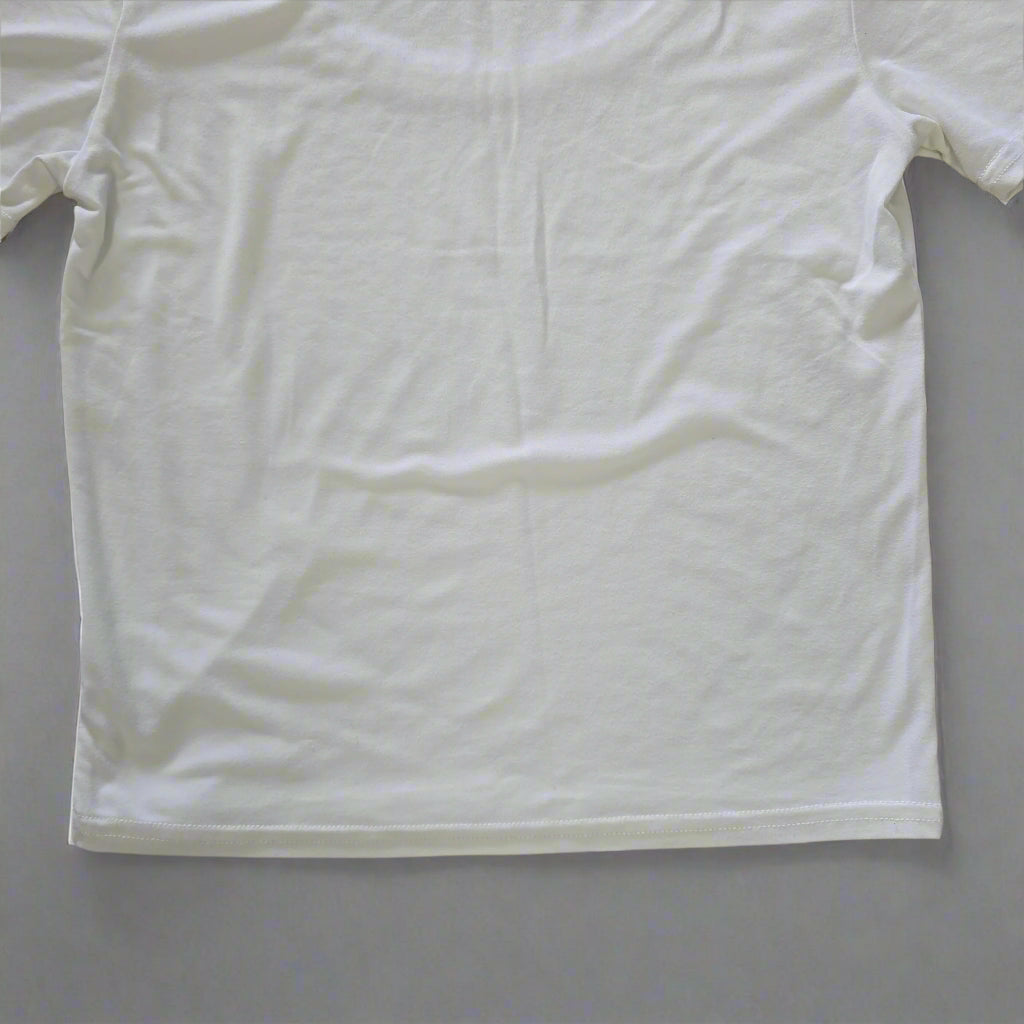 White t-shirt on a tiled floor