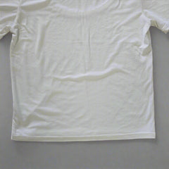 White t-shirt on a tiled floor