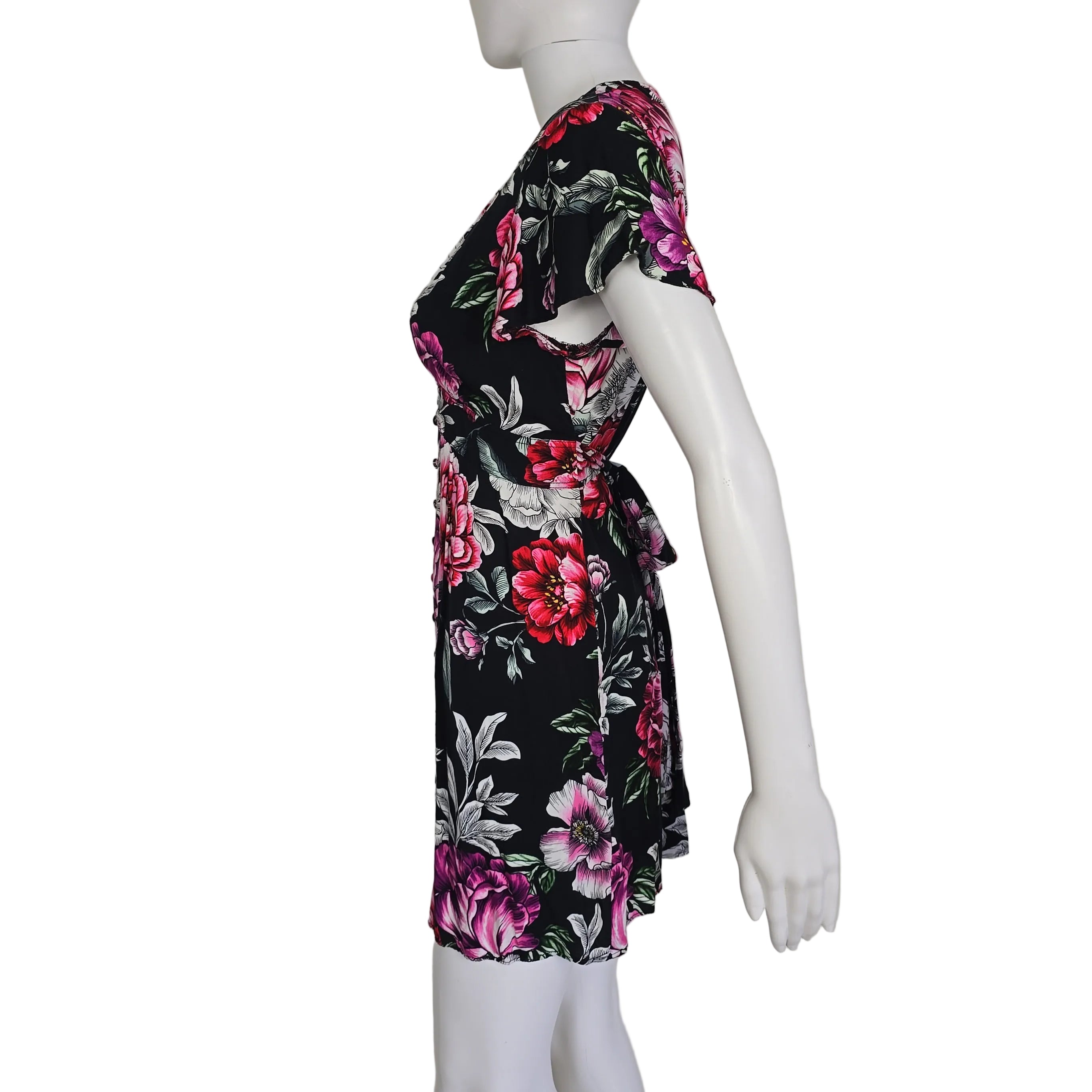 Floral-patterned dress on a mannequin against a neutral background