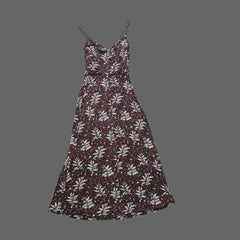 Floral-patterned dress on a tiled floor