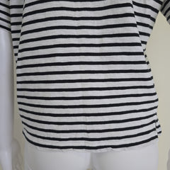 Black and white striped top on a white surface