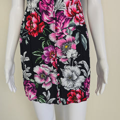 Floral-patterned mini dress on a light background