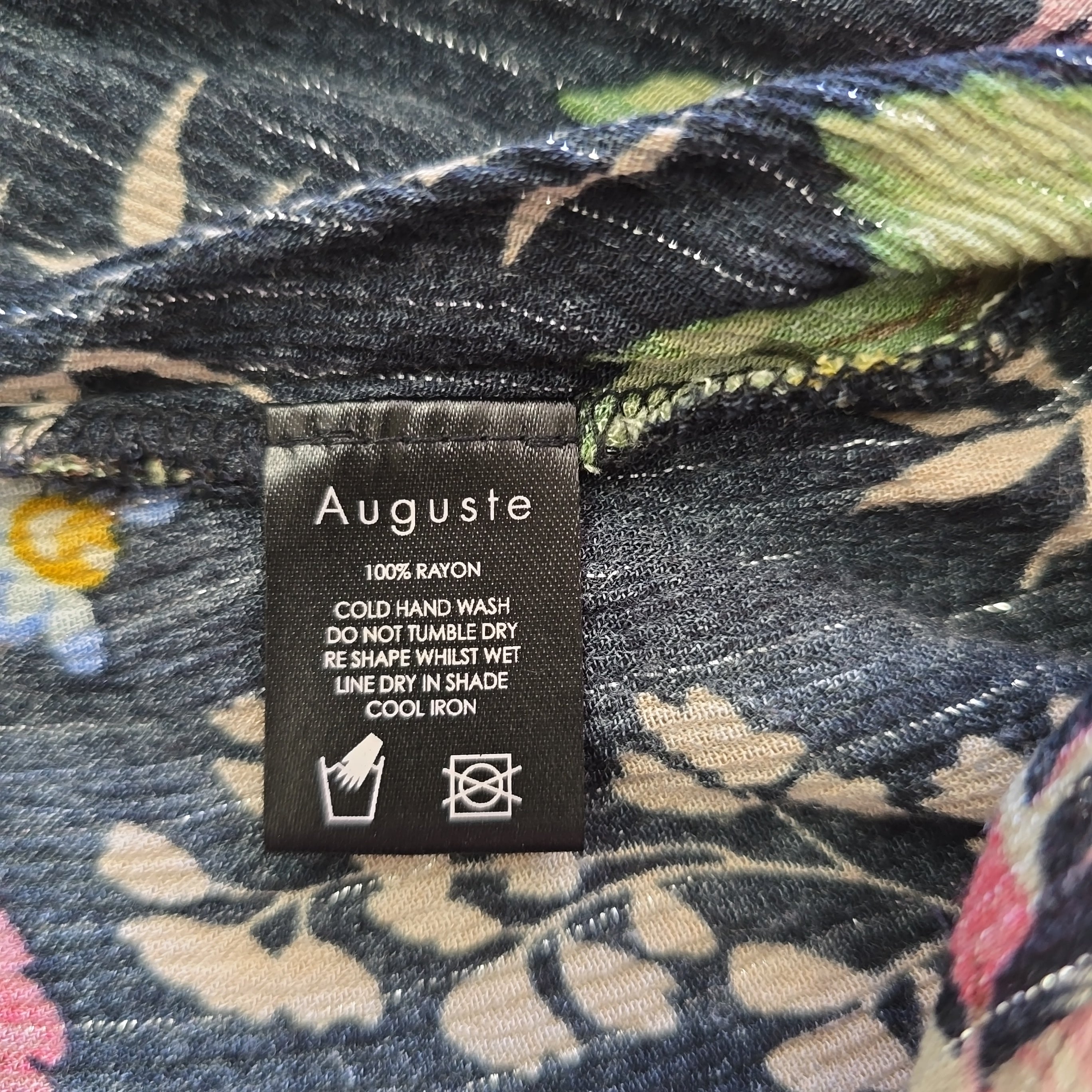 Floral fabric with an Auguste label on a floral background