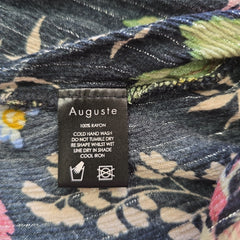 Floral fabric with an Auguste label on a floral background