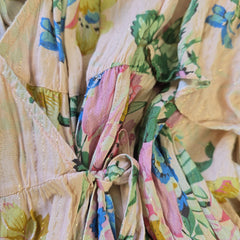 Close-up of a colorful floral fabric with pastel shades.