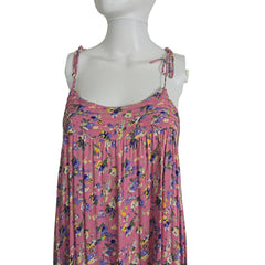 Mannequin wearing a pink floral dress against a plain background