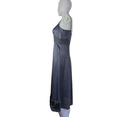 Mannequin wearing a dark gray dress against a plain background