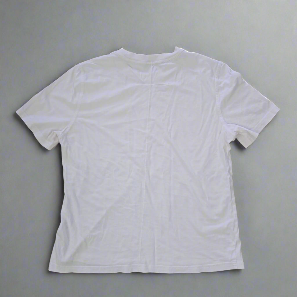 White t-shirt on a tiled floor