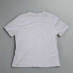 White t-shirt on a tiled floor