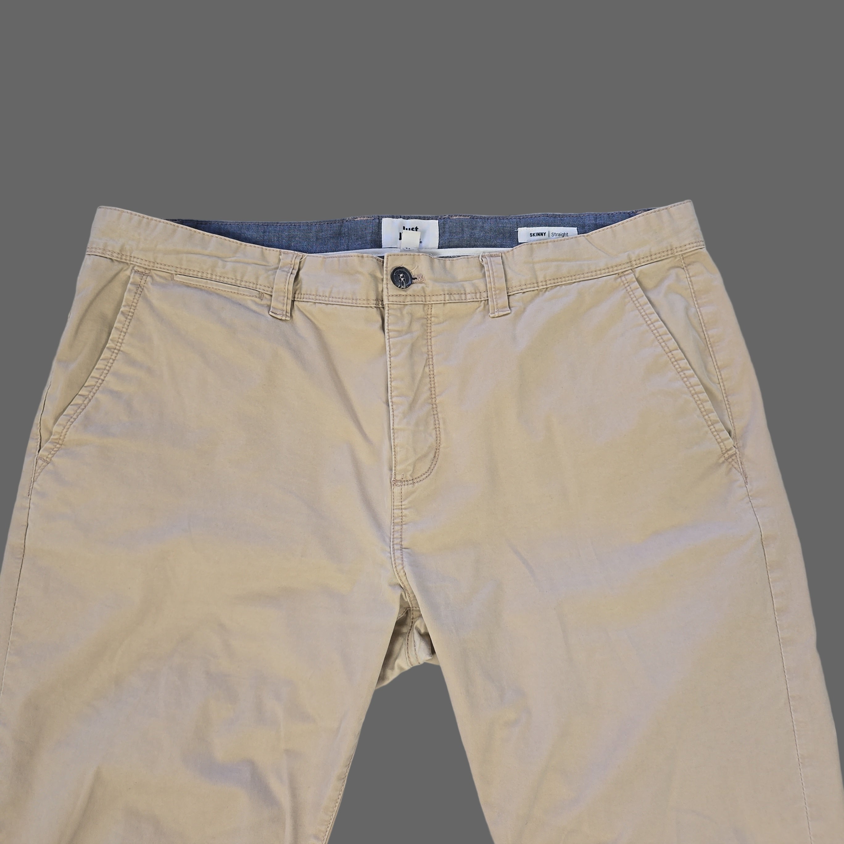 Beige pants on a tiled floor