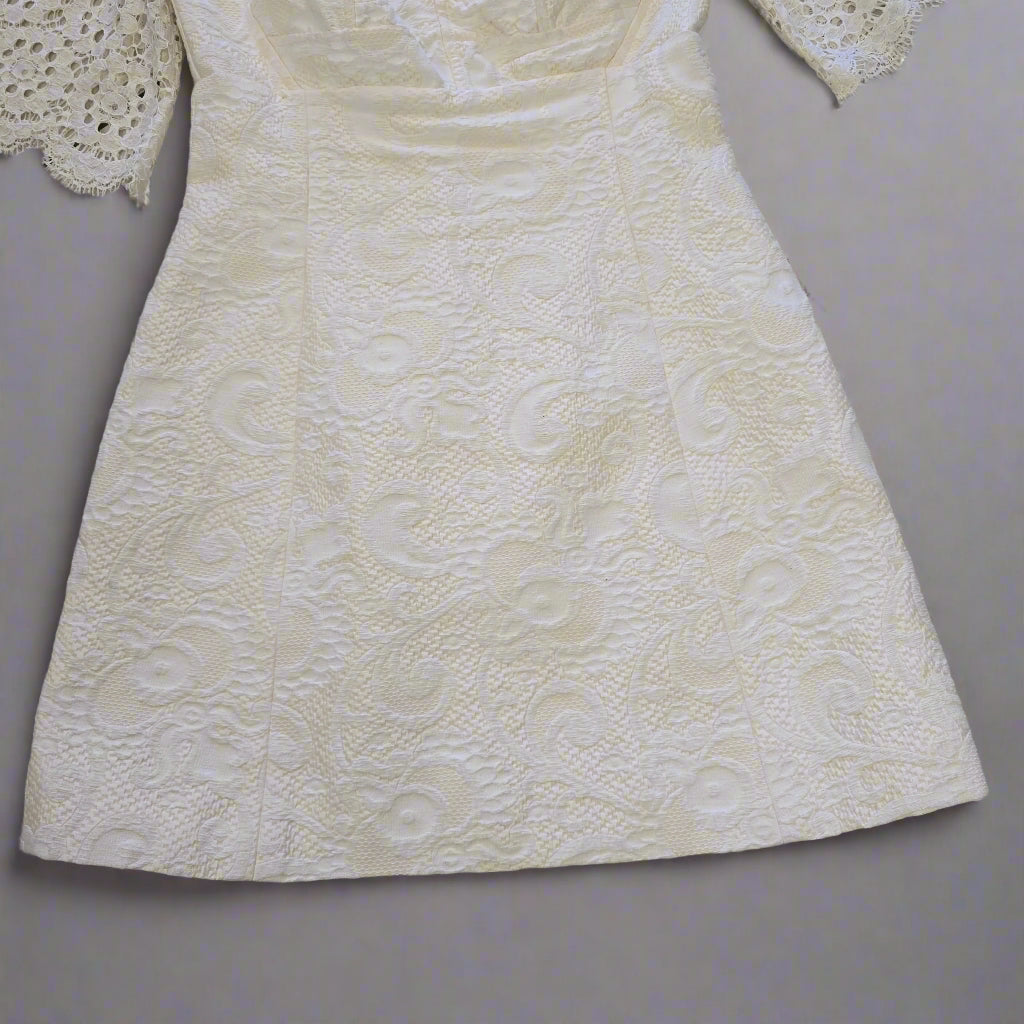 White textured dress on a tiled floor