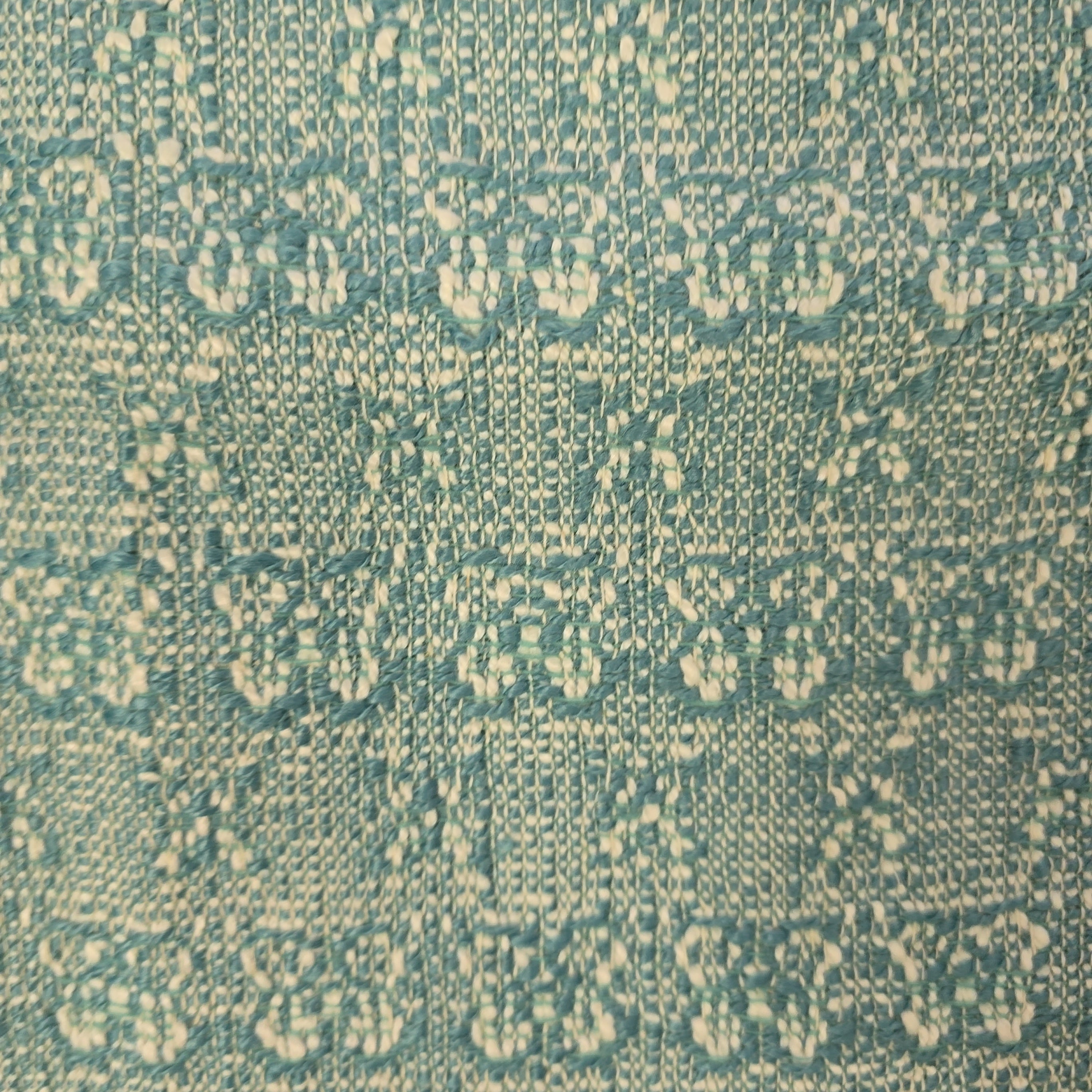 Textured green fabric pattern