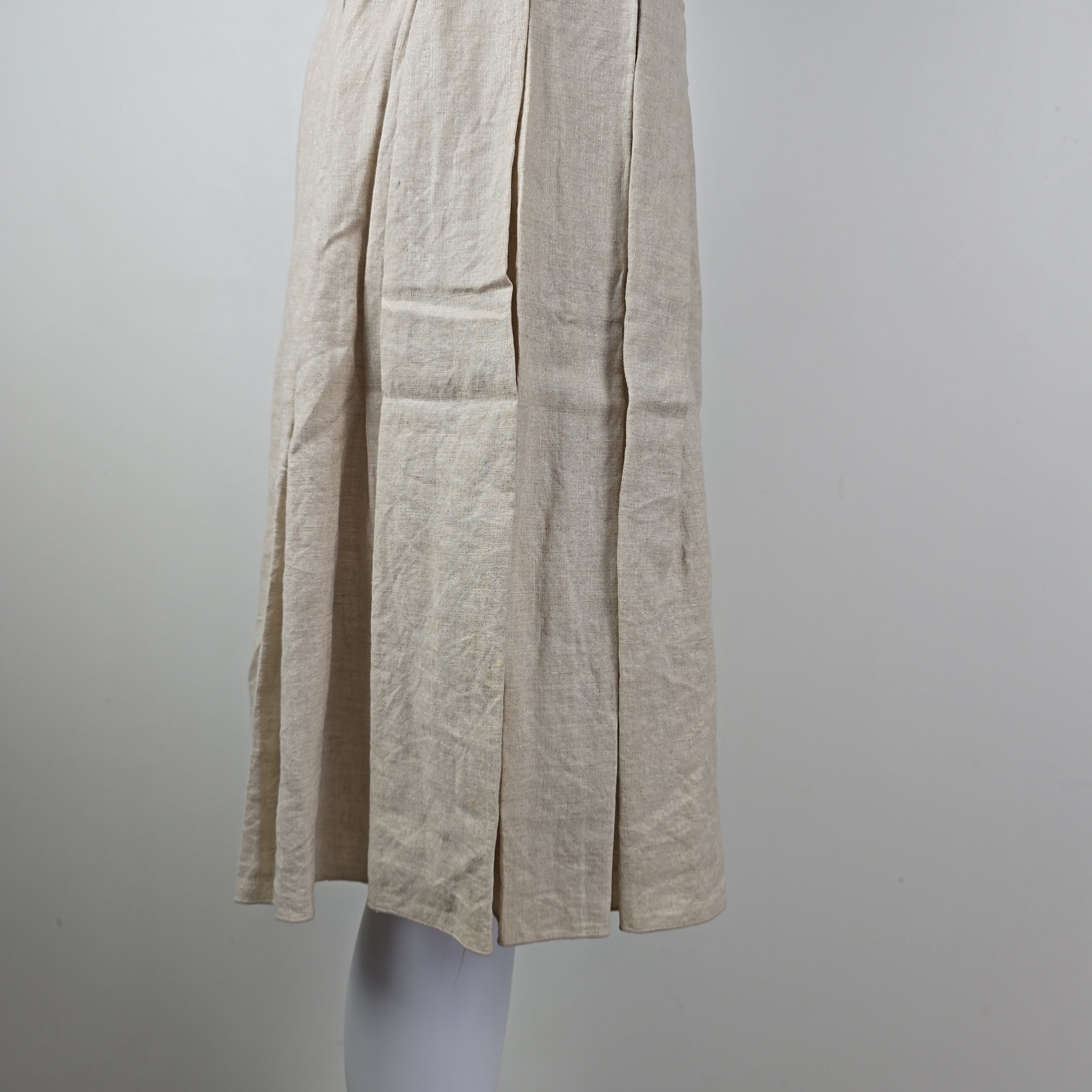 Stack of beige skirt on a gray background