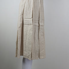 Stack of beige skirt on a gray background