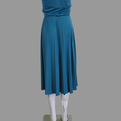 Blue pleated skirt on a white surface