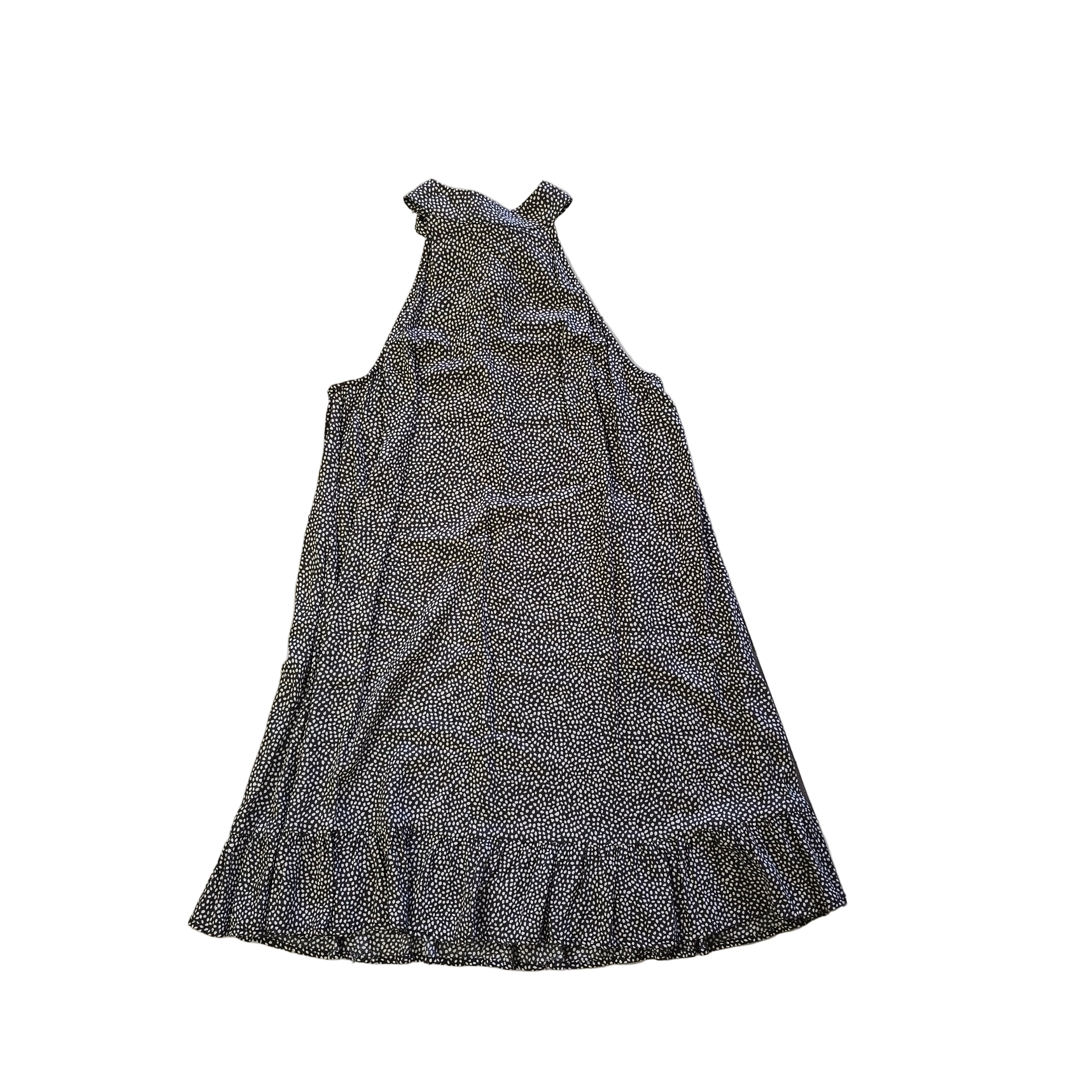 Grey and white spotted patterned dress on a light background